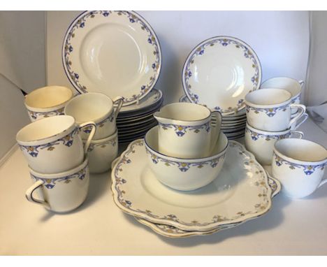 A Foley China part teaset, pattern number 233, blue border with floral swags in blue with core highlights, comprising 12 tea 