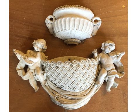Two garden wall hanging planters, both in classical style, the larger planter flanked with children playing instruments 53cm 