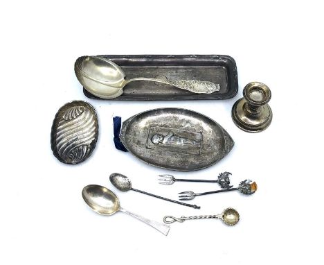 A sterling silver spoon, a silver engine turned rectangular trinket tray, an oval trinket tray, a silver dwarf candlestick, t