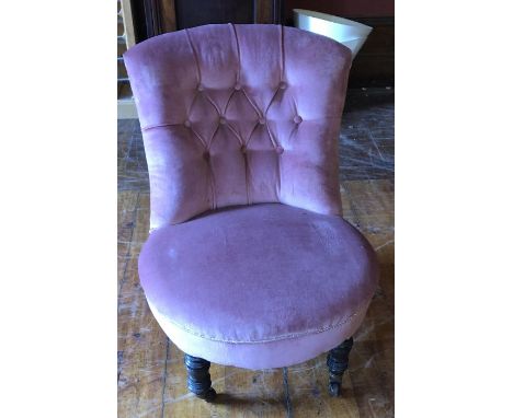 A Victorian button back nursing chair, raised on turned front legs and casters 70cm H x 58cm W x 65cm D&nbsp;