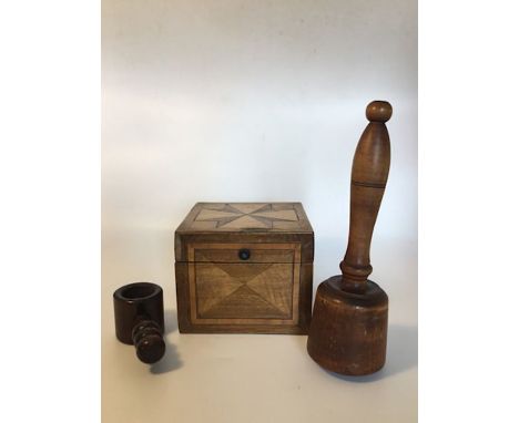 Treen: a screw type nutcracker, a Victorian kitchen pounder/masher and a decorative box with numerous wood types within the m