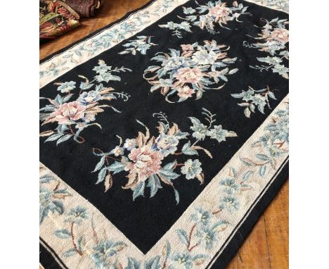 An early 20th century floral tapestry style rug 120cm x 181cm&nbsp;