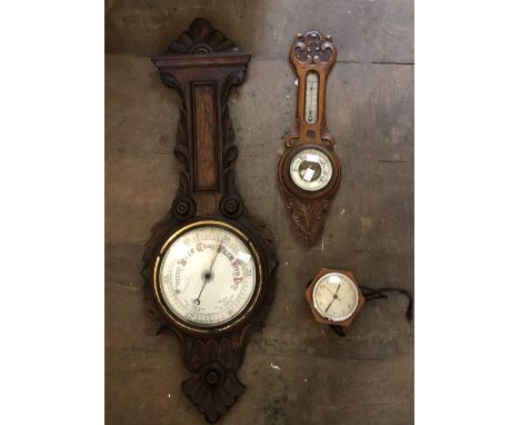 Two barometers, one including thermometer and a 1940's Bakelite electric clock