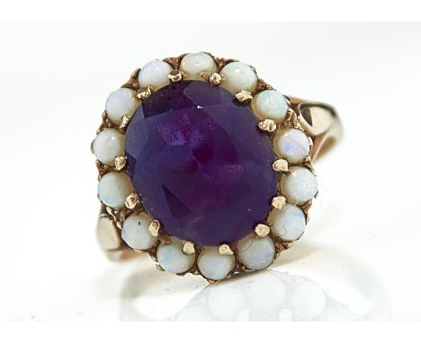 AN AMETHYST AND OPAL CLUSTER RING IN 9CT GOLD, BIRMINGHAM, DATE LETTER RUBBED, 4.3G, SIZE P Amethyst and opal in good conditi