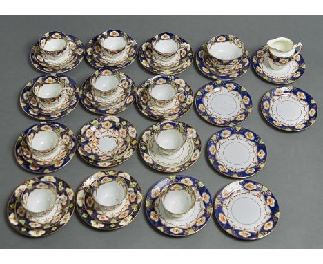 A FIELDINGS TEA SERVICE, PRINTED AND PAINTED WITH RIBBON TIED HAREBELLS WITHIN A BORDER OF FLORAL SPRAYS ON QUADRUPLE PANELLE