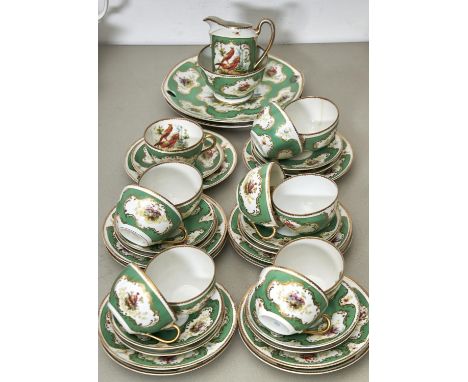 A CONTINENTAL PORCELAIN TEA SERVICE, COMPRISING ELEVEN CUPS, ELEVEN SAUCERS, TEN SIDE PLATES, TWO BREAD AND BUTTER PLATES, SU