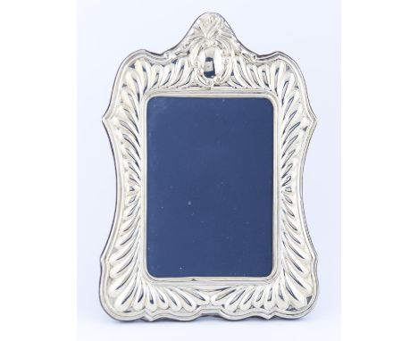 A SILVER PHOTOGRAPH FRAME, OF RECENT MANUFACTURE, LOBED DIE STAMPED MOUNT, 31 X 22CM Light wear and polish residues