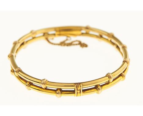A GOLD BAMBOO FORM BANGLE, EARLY 20TH C, 64MM, MARKED 18CT, 14G Good condition