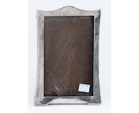 A GEORGE V SILVER PHOTOGRAPH FRAME, QUITE PLAIN, 21 X 14.5CM, BY SANDERS AND MACKENZIE, BIRMINGHAM 1924 Light polish scratche