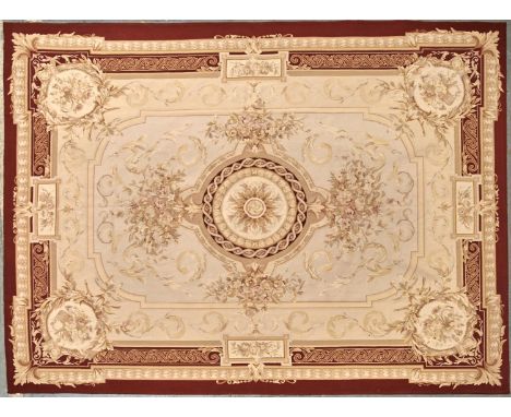 AN AUBUSSON TAPESTRY RUG, 20TH C, IN LOUIS XV STYLE, WITH ROUND GUILLOCHE MEDALLION AND FLOWERS IN IMBRICATED RED BORDER, 273