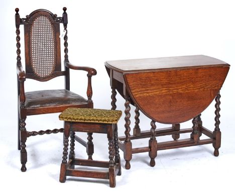 AN OAK OVAL GATELEG DINING TABLE, C1920, THE TOP WITH PAIR OF LEAVES ON BARLEY TURNED LEGS JOINED BY STRETCHERS, 90CM W; TOGE