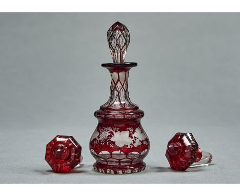 A FACETED RUBY FLASHED GLASS SCENT BOTTLE AND STOPPER, MID 19TH C, ENGRAVED WITH TRAILING GRAPEVINES, 16.5CM H AND A PAIR OF 