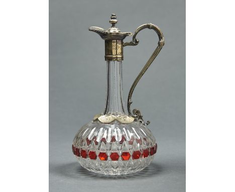 AN EPNS MOUNTED RUBY FLASHED AND CUT GLASS CLARET JUG, C1870, CORK STOPPER, 27CM H Plating worn and with polish residue.  One