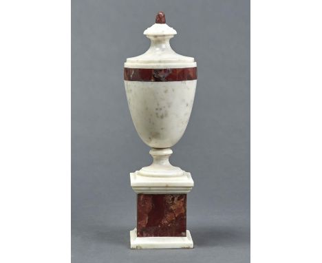 A MARBLE URN, 20TH C, IN NEO CLASSICAL STYLE, OF SHIELD SHAPE WITH BAND OF RED BRECCIA MARBLE AND CONFORMING PLINTH, 38CM H S