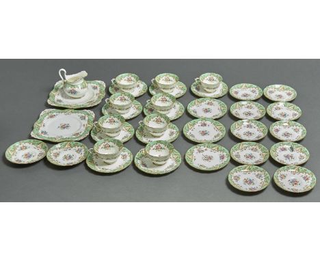 A TUSCAN CHINA TEA SERVICE, COMPRISING NINE CUPS, TWELVE SAUCERS, TWELVE TEA PLATES, CREAM JUG AND TWO BREAD AND BUTTER PLATE