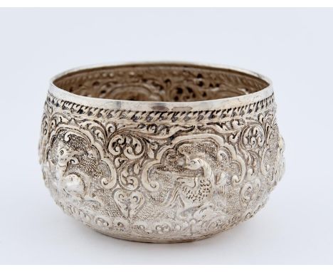 A BURMESE SILVER REPOUSSE BOWL, C1900, IN THE FORM OF AN ALMS BOWL, 12CM DIAM, 7OZS 3DWTS Good condition, slight polish resid