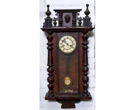 A WALNUT VIENNA WALL CLOCK, C1890, THE PEDIMENT WITH SPLIT PILLARS, MASK AND BALL AND SPIRE FINIALS, PAPERED DIAL WITH ROMAN 