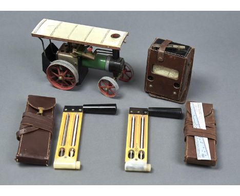 A MAMOD TRACTION ENGINE, VOLTAGE TESTER, TEMPERATURE TOOLS AND SLIDE RULE 