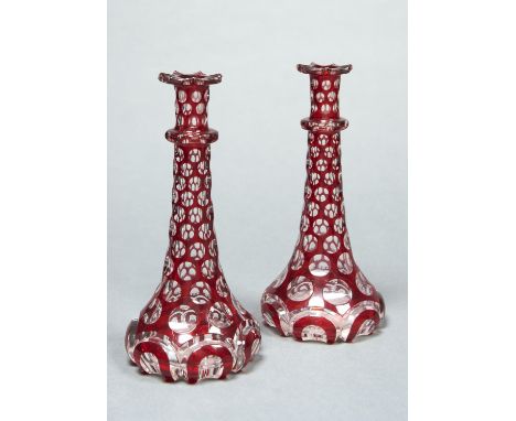 A PAIR OF ENGLISH RUBY CASED AND CUT&nbsp; GLASS&nbsp; DECANTERS, C1845, 22.5CM HComparative Literature: Hajdamach (C R), Bri