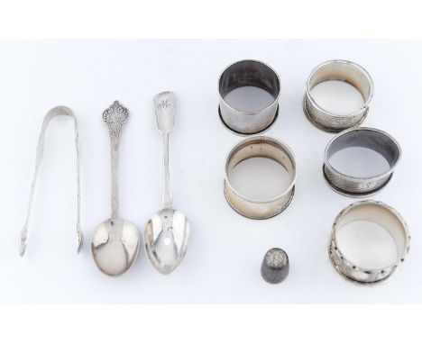 FIVE EDWARDIAN AND LATER SILVER NAPKIN RINGS, A BRITANNIA STANDARD REPLICA LACE BACK SPOON, A TEASPOON, PAIR OF SUGAR BOWS AN