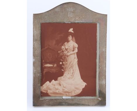 A GEORGE V SILVER PHOTOGRAPH FRAME, ENGRAVED WITH THE CORONET OF A BARON AND INITIAL R, 27.5CM H, BY WILLIAM COMYNS &amp; SON