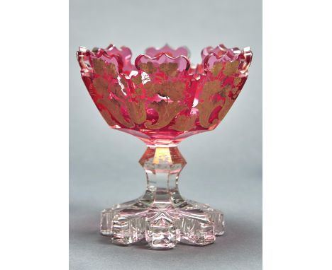 A&nbsp; RUBY FLASHED AND CLEAR GLASS PEDESTAL BOWL, C1860, DECORATED IN MATT AND BURNISHED GILDING WITH CORNUCOPIAE, LEAVES A