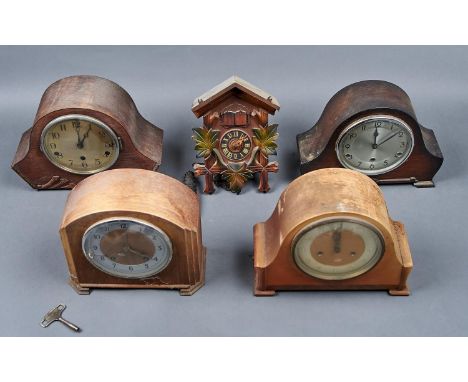 FOUR MANTEL CLOCKS, ALL C1950, THREE WITH OAK VENEERED CASES, THE OTHER MAHOGANY, ALL WITH CIRCULAR DIALS AND ARABIC NUMERALS