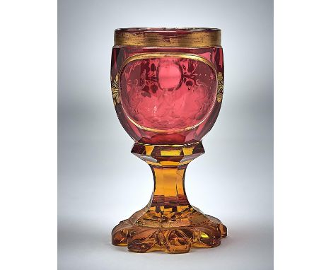 A BOHEMIAN RUBY AND AMBER CASED GLASS GOBLET, C1850, THE BOWL ENGRAVED WITH AN OVAL PANEL OF THE FATES ON CLOUDS BENEATH INSC