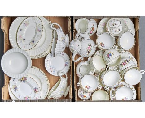 A ROYAL WORCESTER ROANOKE DINNER AND BREAKFAST SERVICE, TRANSFER PRINTED WITH FLORAL SPRAYS ON THE FLUTED BODIES, GILT LINE R