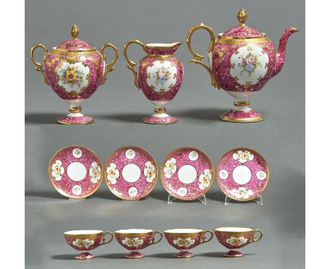 A NORITAKE TEA SERVICE, EARLY 20TH C, OF VASE SHAPE PAINTED WITH FLOWERS IN RAISED GILT RESERVES ON A MOTTLED ROSE COLOURED G