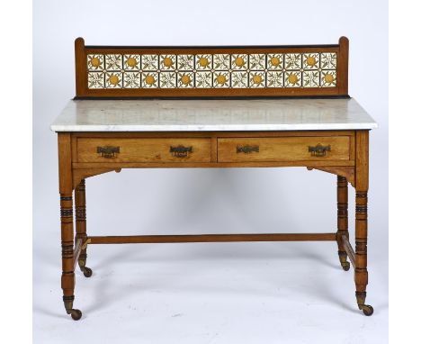 A VICTORIAN OAK WASHSTAND WITH MINTON CHINA WORKS TILED BACK, C1875, THE TILES TRANSFER PRINTED WITH ORANGES AND BLOSSOM, THE