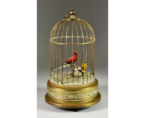 A Continental Bird in a Cage Automaton, Early 20th Century, with domed brass wirework cage and musical mechanism to base, 11i
