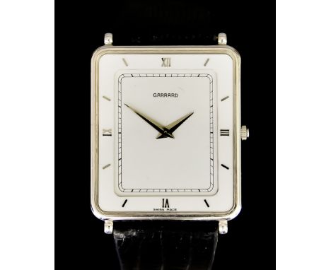 A Manual Wind or Quartz Wristwatch by Garrard, 25mm x 30mm diameter 18ct white gold case, white dial with silver Roman baton 