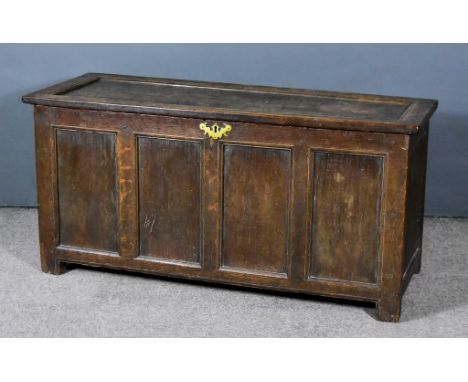 A 17th Century Panelled Oak Coffer, with single panelled lid and four panelled front, 51ins wide x 20ins deep x 23ins highTo 