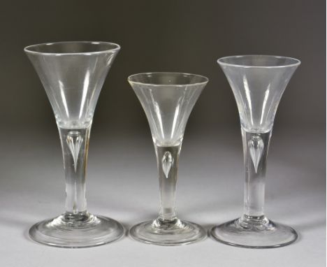 Three Wine Glasses, 18th Century, comprising - drawn trumpet bowl with plain tear drop stem on folded foot, 6.5ins high, a si