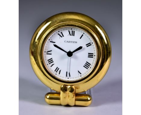 A Must De Cartier "Colisee" Folding Travel Alarm Clock, No. 0539102, the white enamel dial with Roman numerals, contained in 