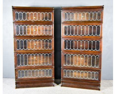 A Pair of Early 20th Century Globe Wernicke Oak Five Tier Sectional Bookcases, with moulded cornices, each tier with leaded g