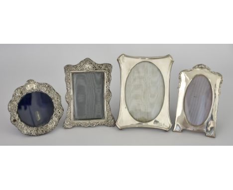 Four Silver Photograph Frames, including one by Henry Matthews Chester 1900, of rectangular shaped outline, pierced and embos