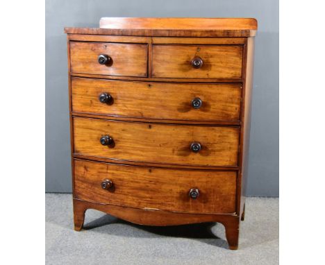 A Victorian Mahogany Bow Front Chest with square edge to top, fitted two short and three long drawers on shaped apron and bra