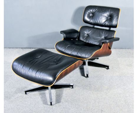 A Ray &amp; Charles Eames for Herman Miller Rosewood Veneered and Metal Framed Lounge Chair, No. 670, and Ottoman, No. 671, t