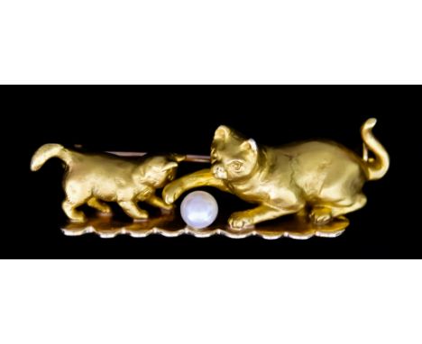 A 9ct Gold Brooch, depicting a cat and kitten playing with a ball in the form of a small pearl, 40mm x 15mm, total gross weig