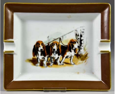 A Hermes Porcelain Rectangular Ashtray, decorated with three basset hounds, gilt edged, 6.25ins x 7.75ins