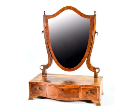 A George III Figured Mahogany Shield-Pattern Toilet Mirror, with cross banded frame, inset with bevelled mirror plate, flanke