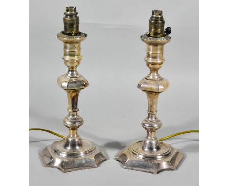 A Pair of Plated Electric Table Lamps in the form of 18th Century pillar candlesticks of octagonal form with knopped stems on
