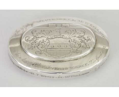 An 18th / 19th Century Oval Snuff Box, unmarked, engraved with crest and leaf scrolls to lid, and presentation inscription " 