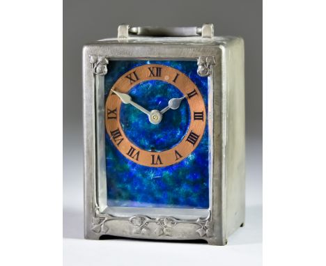 Rex Silver for Liberty &amp; Co - an Arts and Crafts Tudric Pewter and Enamel Carriage Timepiece model 0721, the blue-green m
