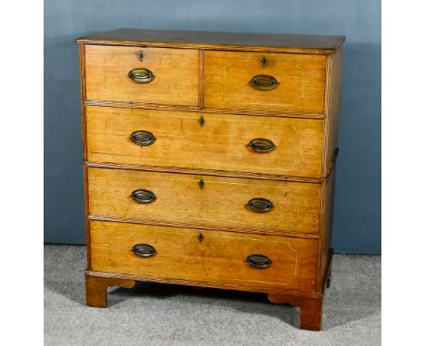 A Late Georgian Mahogany Chest with square reeded edge to top, the front inlaid with stringings, fitted two short and three l