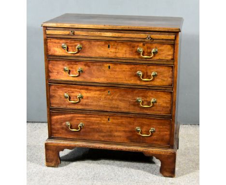 A George III Mahogany Chest with moulded edge to top, fitted slide and four long graduated drawers on bracket feet 31.5ins wi