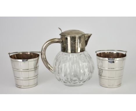 A Pair of Plated Ice Buckets and a plated Mounted and Bulbous Glass Lemonade Jug, the ice buckets by Elkington &amp; Co. of c