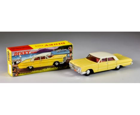 A Dinky Toy Diecast Model Car No. 57/003, "Chevrolet Impala", with white over yellow body, spun hubs, red interior, in&nbsp; 